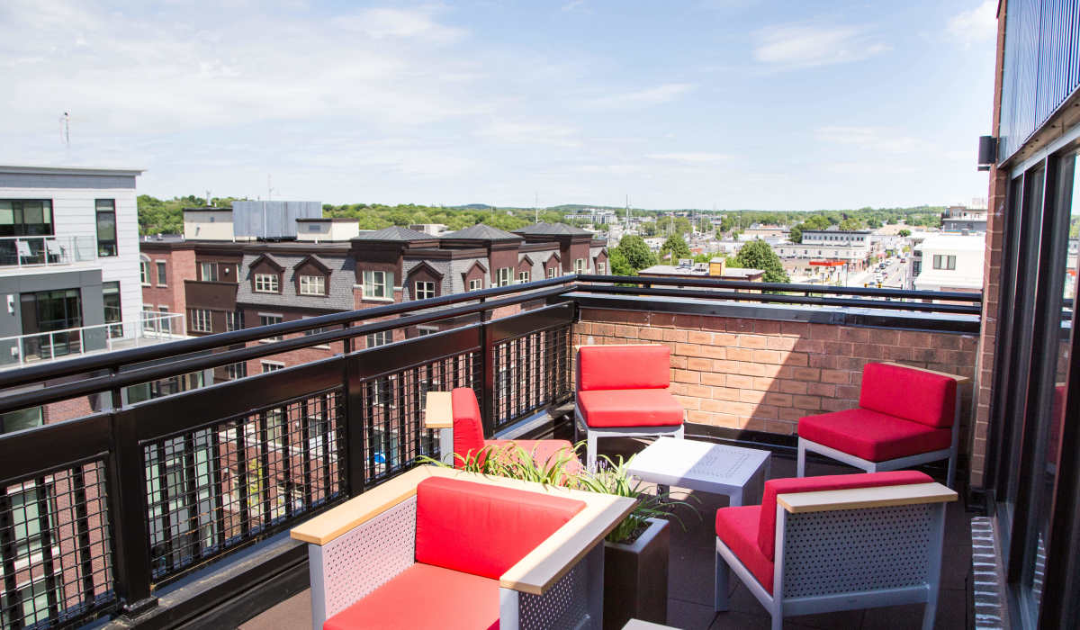 Outdoor sky lounge patio with city views at Station 101 in Beverly, Massachusetts