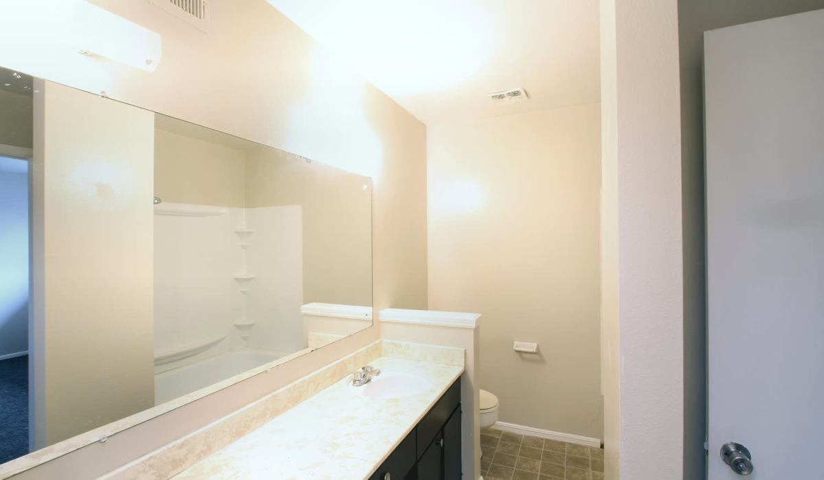 Entry and living room at Magnolia Creek Apartments in Tulsa, Oklahoma