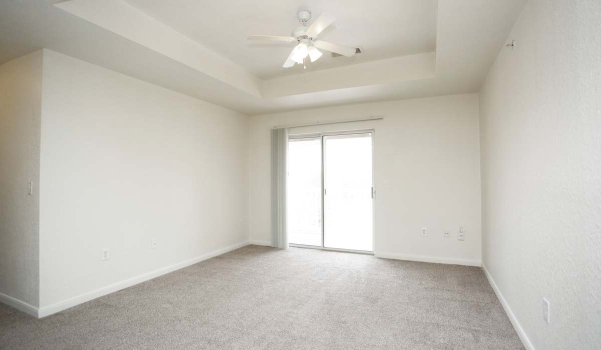 Living room and attached patio at North Oak Crossing in Kansas City, Missouri