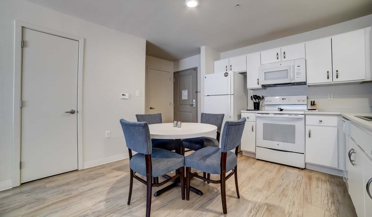 Dining room with kitchen Simplicity at the Rim in San Antonio, Texas