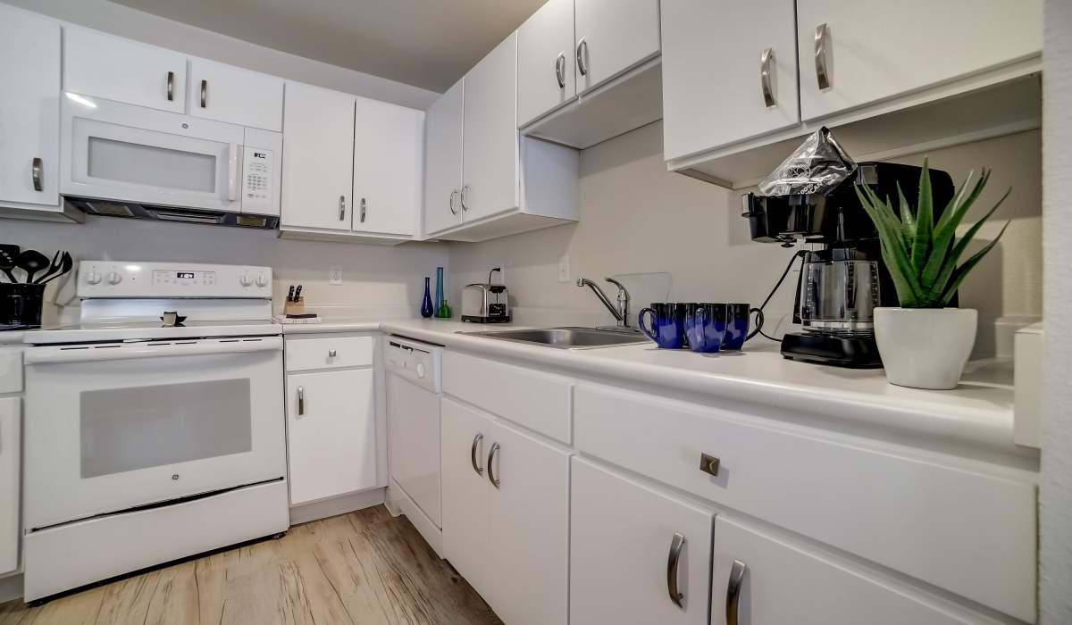 Kitchen with white accents Simplicity at the Rim in San Antonio, Texas