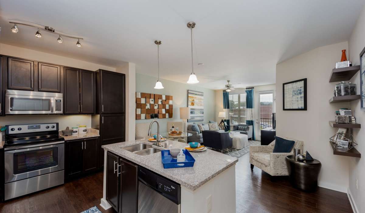 Kitchen and dinning space with wood-style flooring at Lane Parke Apartments in Mountain Brook, Alabama