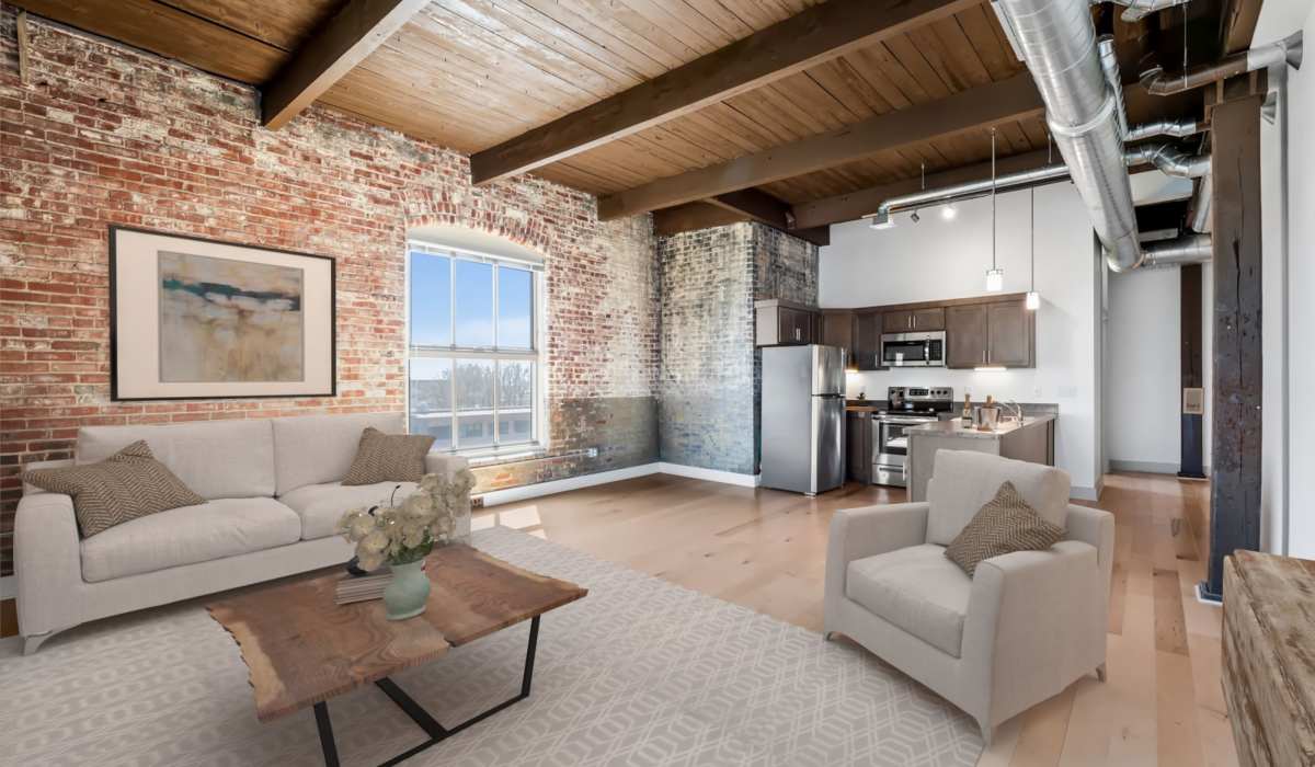 Exposed brick and tall ceilings in a Barcalo Living apartment in Buffalo, New York