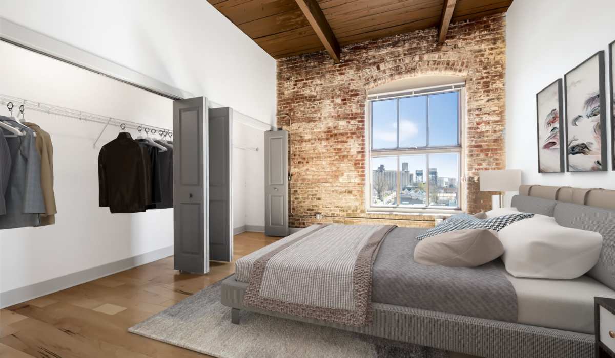 Spacious bedroom with a bright window and tall ceilings at Barcalo Living in Buffalo, New York