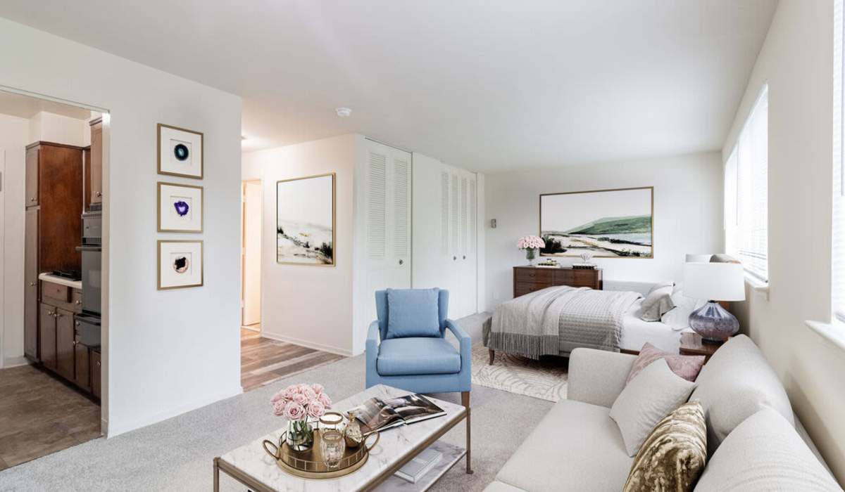 Studio apartment with accent chair at Three Chopt West Apartments in Henrico, Virginia