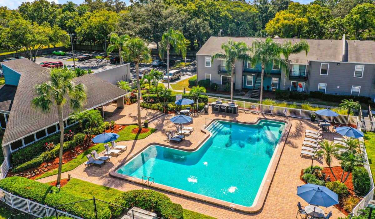 Aerial view of the resort-style swimming pool and playground at Coopers Pond in Tampa, Florida