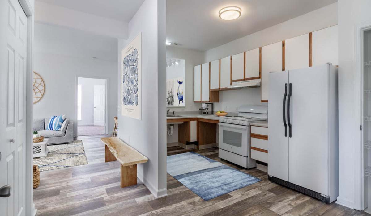 Kitchen with white cabinetry at Sand Ridge in Wilmington, North Carolina