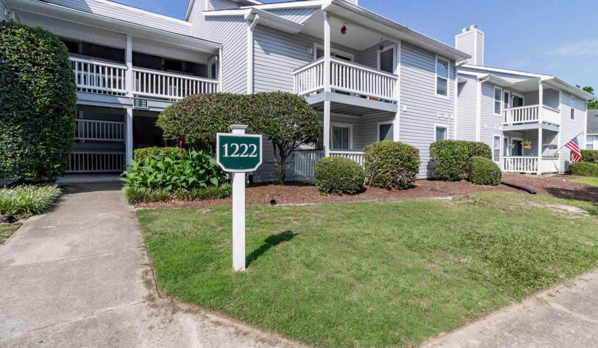 Exterior of apartments with balcony at Sand Ridge in Wilmington, North Carolina