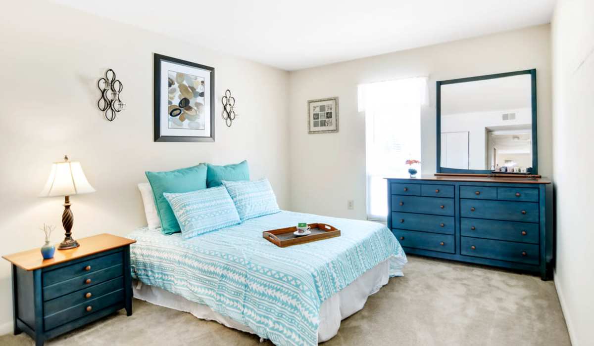 bedroom with blue bedding at North Slope Apartments in Richmond, Virginia