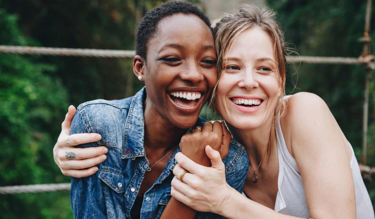 Friends laughing at Castleton Manor Apartments in Indianapolis, Indiana