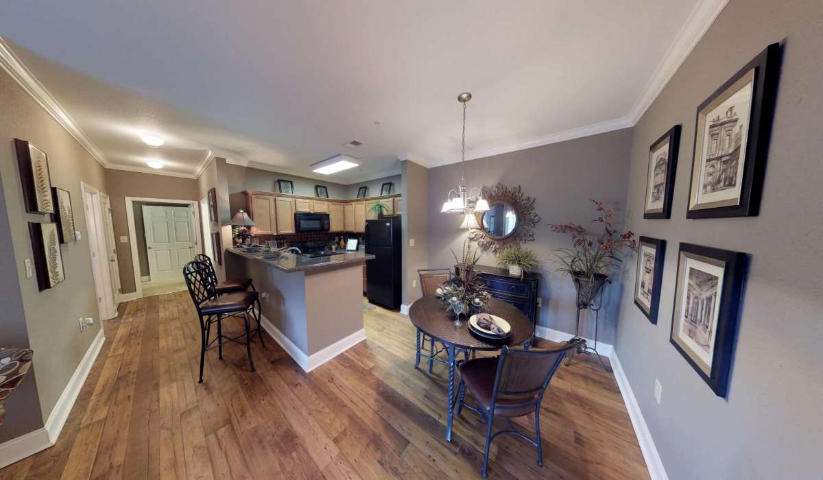 Kitchen and dinning space with wood-style flooring at The Enclave of Hardin Valley in Knoxville, Tennessee