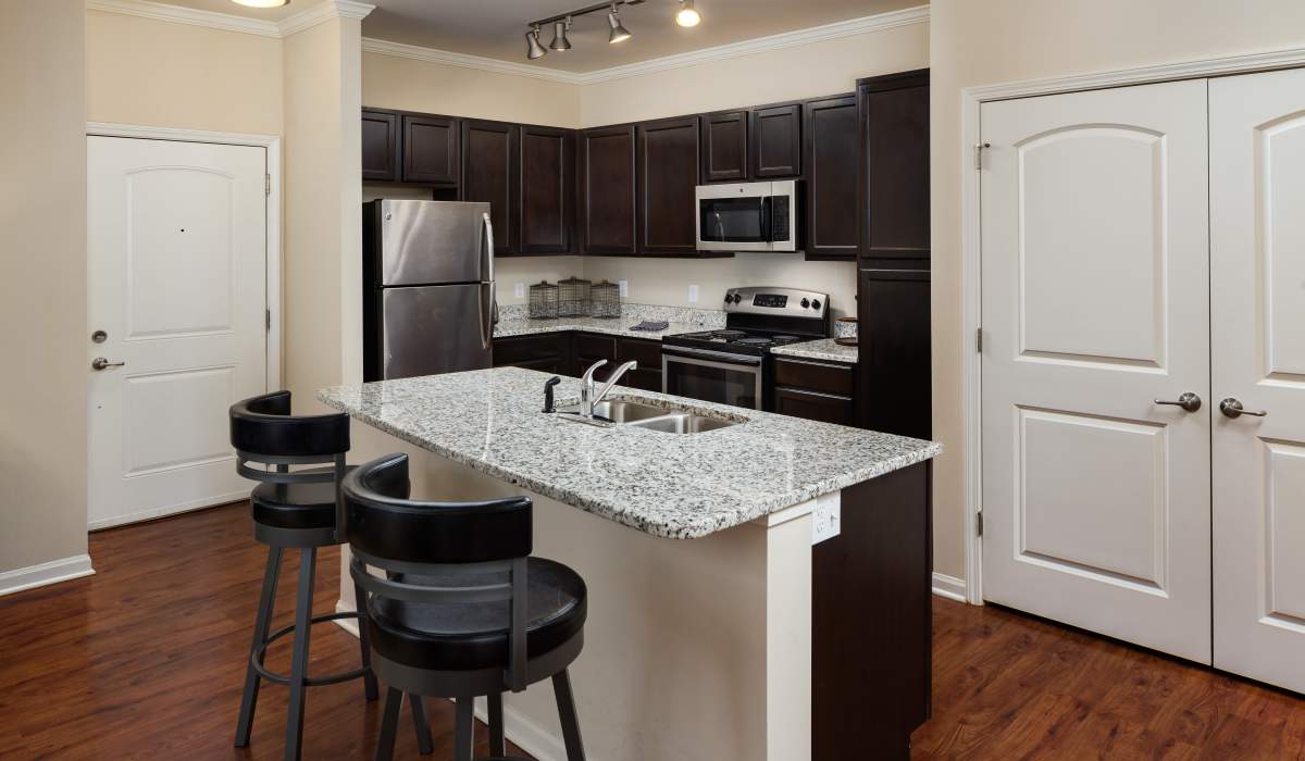 Kitchen with beautiful wood-style flooring at The Preserve at Hardin Valley in Knoxville, Tennessee