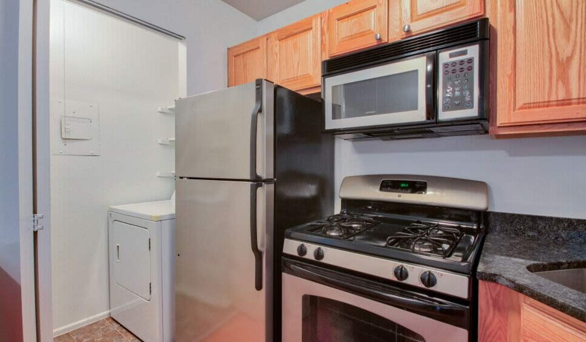 Kitchen with stainless steel appliances at Cloverleaf Lake Townhouse Apartments in North Chesterfield, Virginia
