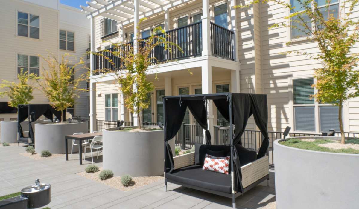 Covered patio seating at The Dylan Apartment Homes in Hercules, California