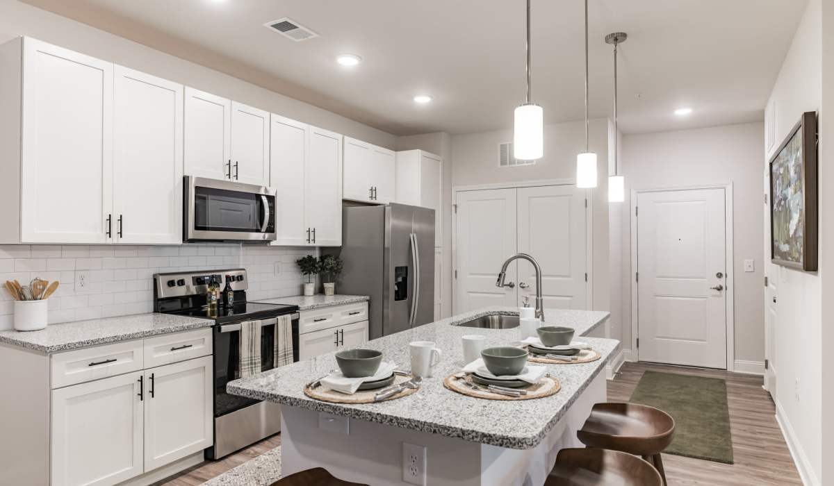 Beautiful kitchen with island in a model home at The Standard at Pinestone in Travelers Rest, South Carolina