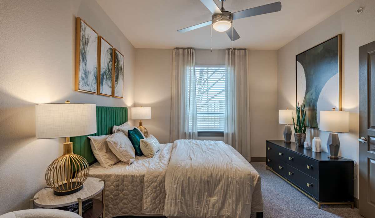 Spacious bedroom with a cozy bed and a window at Dayrise at Centreport in Fort Worth, Texas
