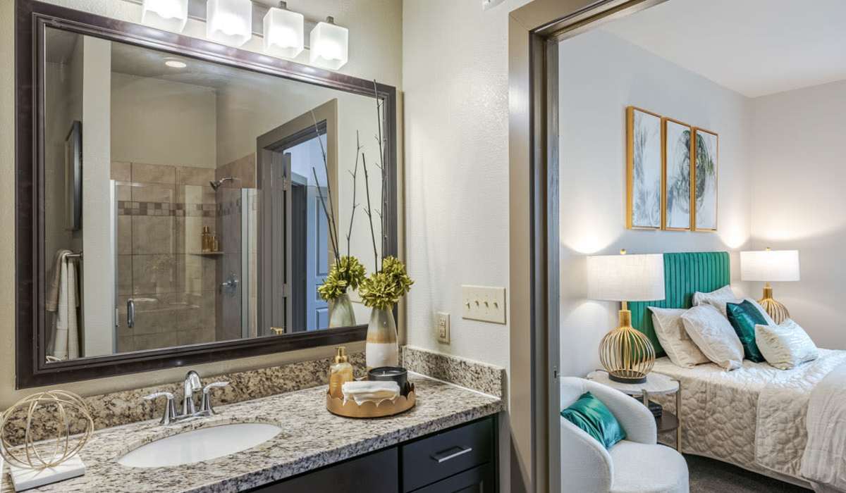 Modern bathroom with large mirror at Dayrise at Centreport in Fort Worth, Texas
