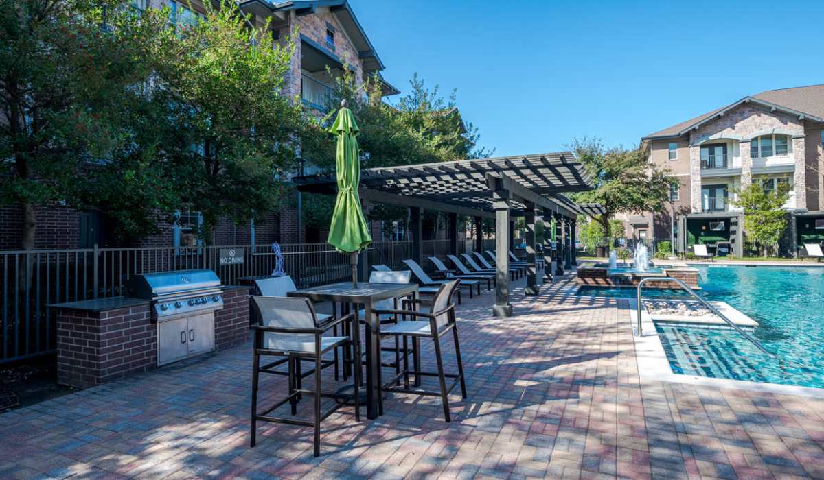 Poolside BBQ area at Dayrise at Centreport in Fort Worth, Texas