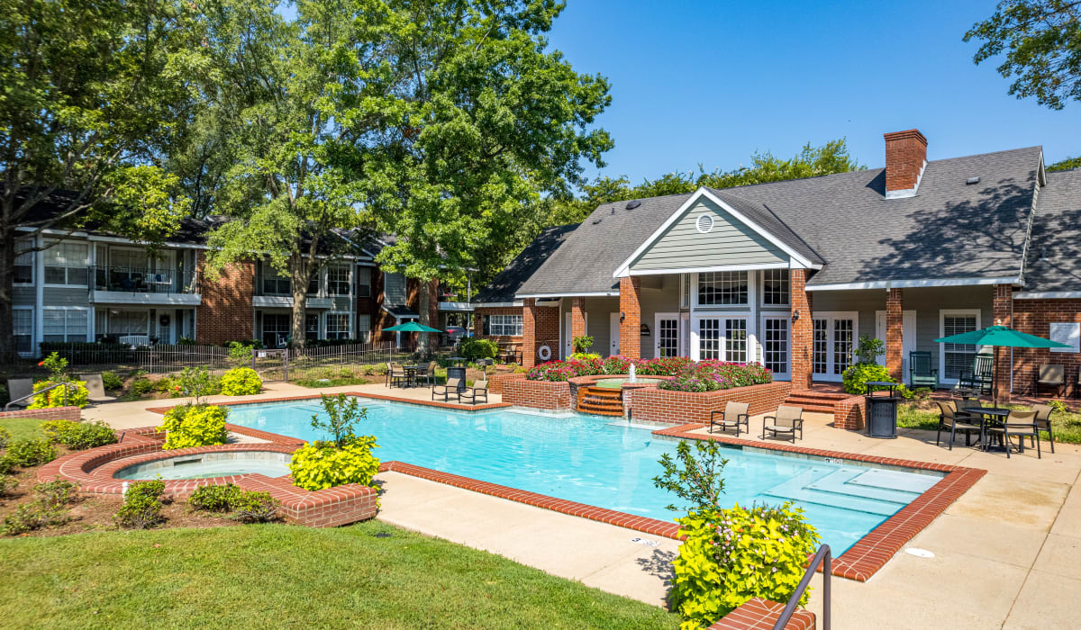 Swimming pool in front of the building and trees all around at The Willows in Shreveport, Louisiana