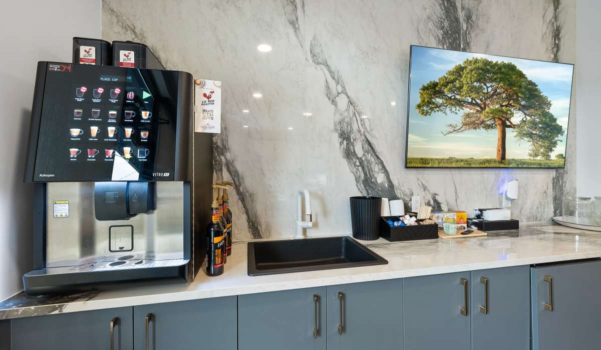 Clubhouse cafe area with coffee machine at The Acorn on Person Street in Raleigh, North Carolina