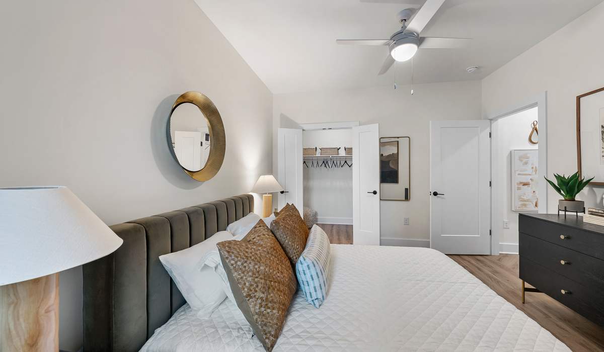 Bedroom with attached closet at The Acorn on Person Street in Raleigh, North Carolina