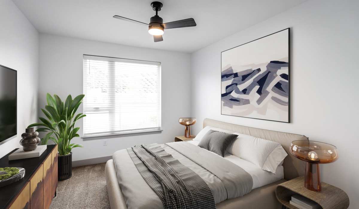 Bedroom with a ceiling fan in a model home at Sphere Apartments in Richmond, Virginia