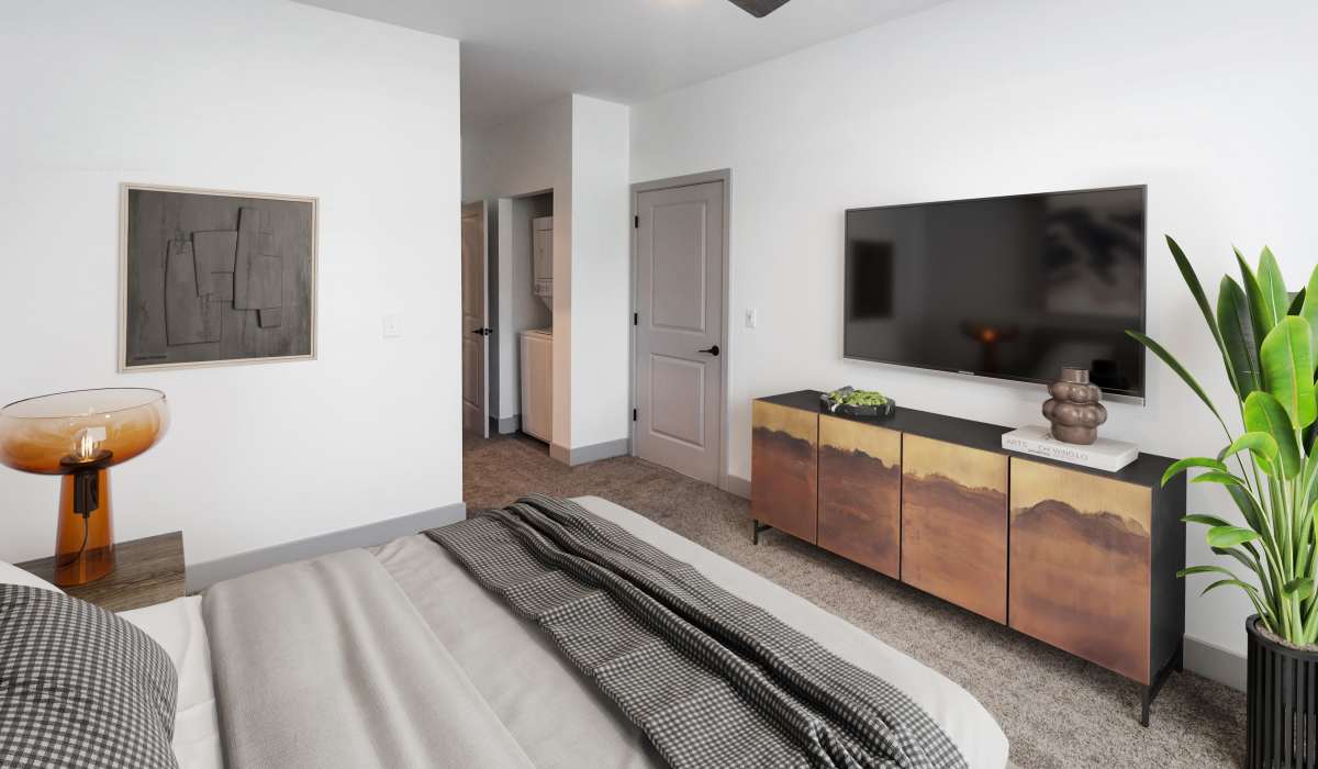 Bedroom with television in a model home at Sphere Apartments in Richmond, Virginia