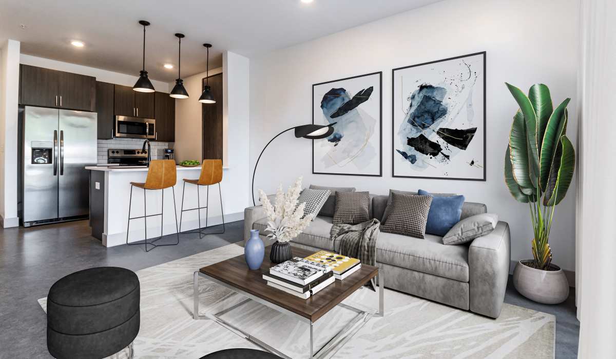 Living room with white walls and couch in a model home at Sphere Apartments in Richmond, Virginia