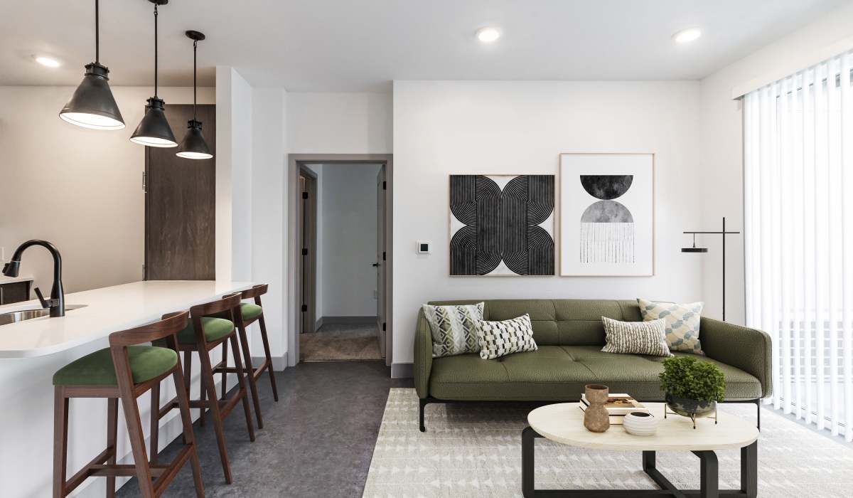 Living room and kitchen bar-top in a model home at Sphere Apartments in Richmond, Virginia