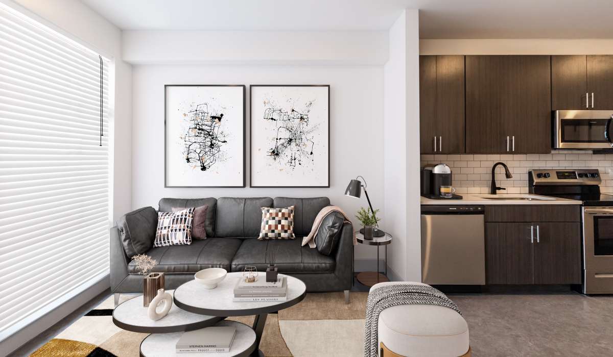 Spacious living room and kitchen in a model home at Sphere Apartments in Richmond, Virginia