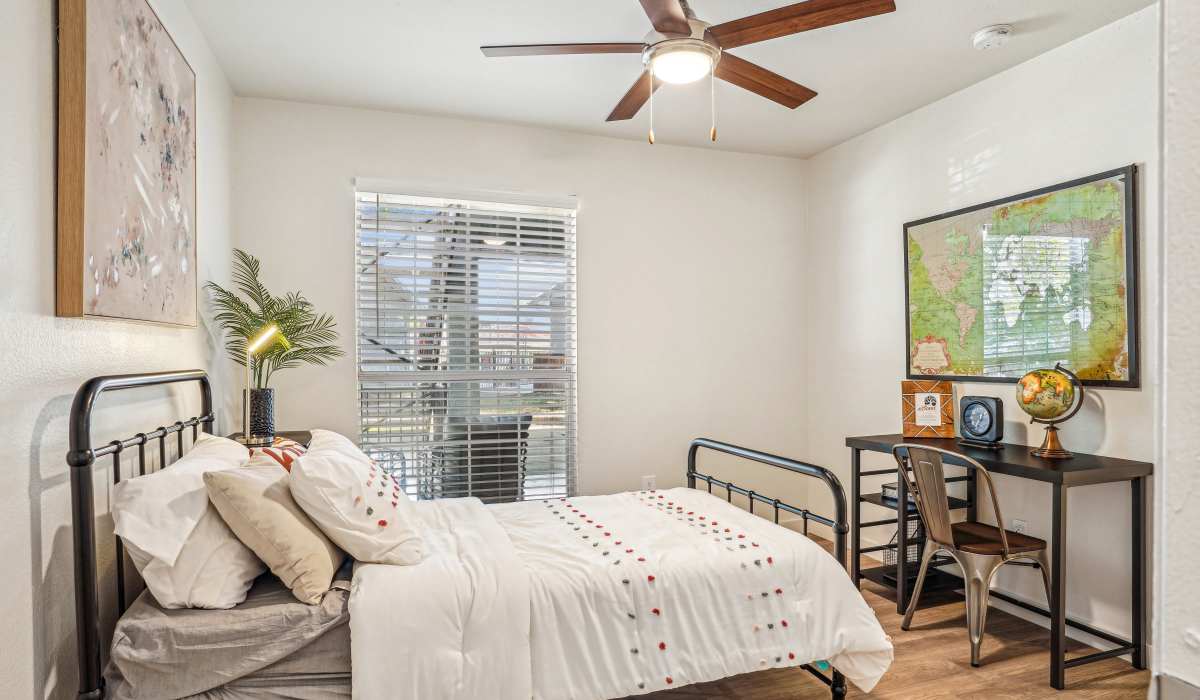 Master bedroom with bathroom at The Rustic of McKinney in McKinney, Texas