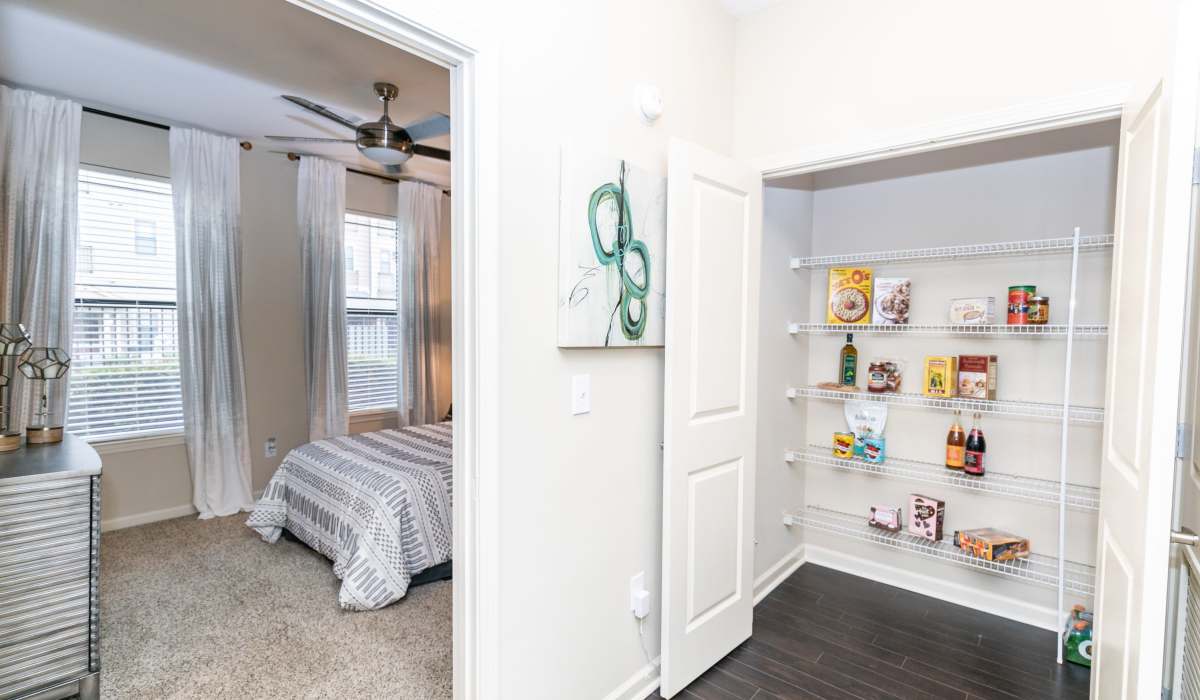 Bedroom and pantry at The Reserve at Johns Creek Walk in Johns Creek, Georgia
