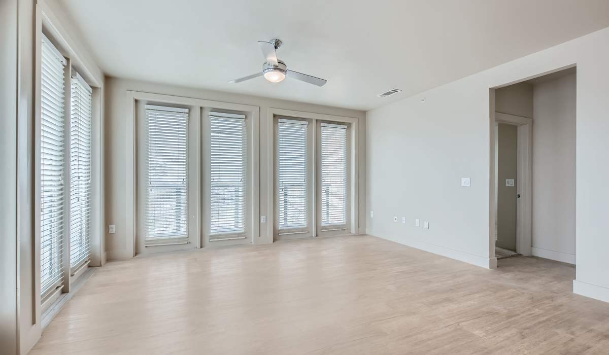  Living room with wood-style flooring at The Lucas Apartments in Dallas, Texas