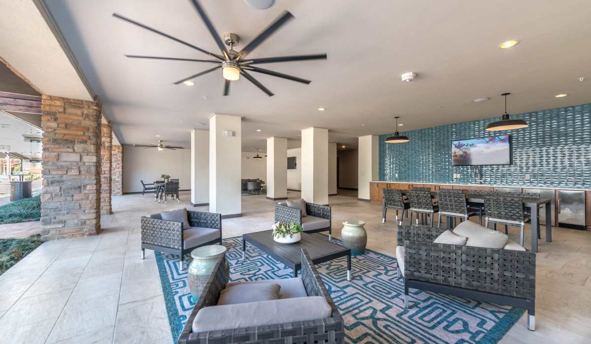 Clubhouse with cozy seating, perfect for outdoor relaxation.at The Lucas Apartments in Dallas, Texas