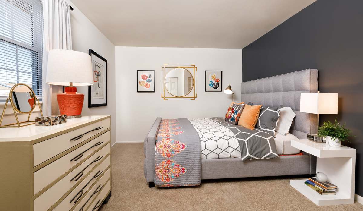 Bedroom with comfortable bed and window at The Landing at Oyster Point in Newport News, Virginia
