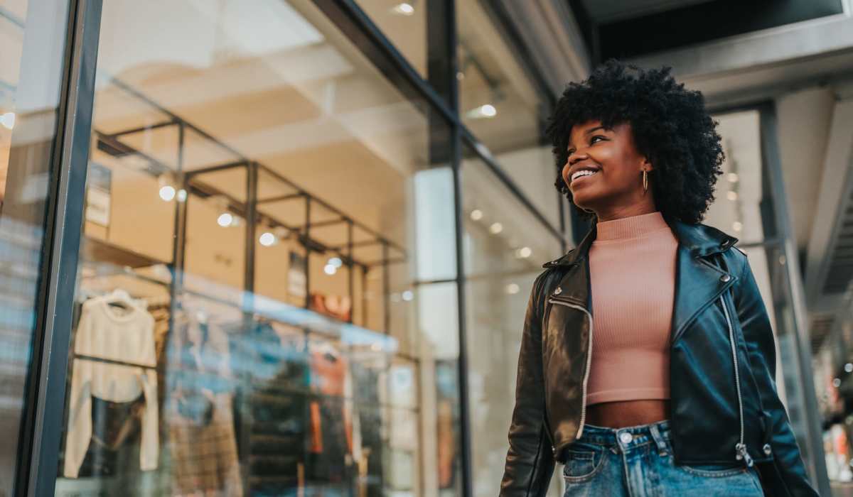 Resident playing with her dog in her spacious apartment at The Residences at Sakura Novi in Novi, Michigan
