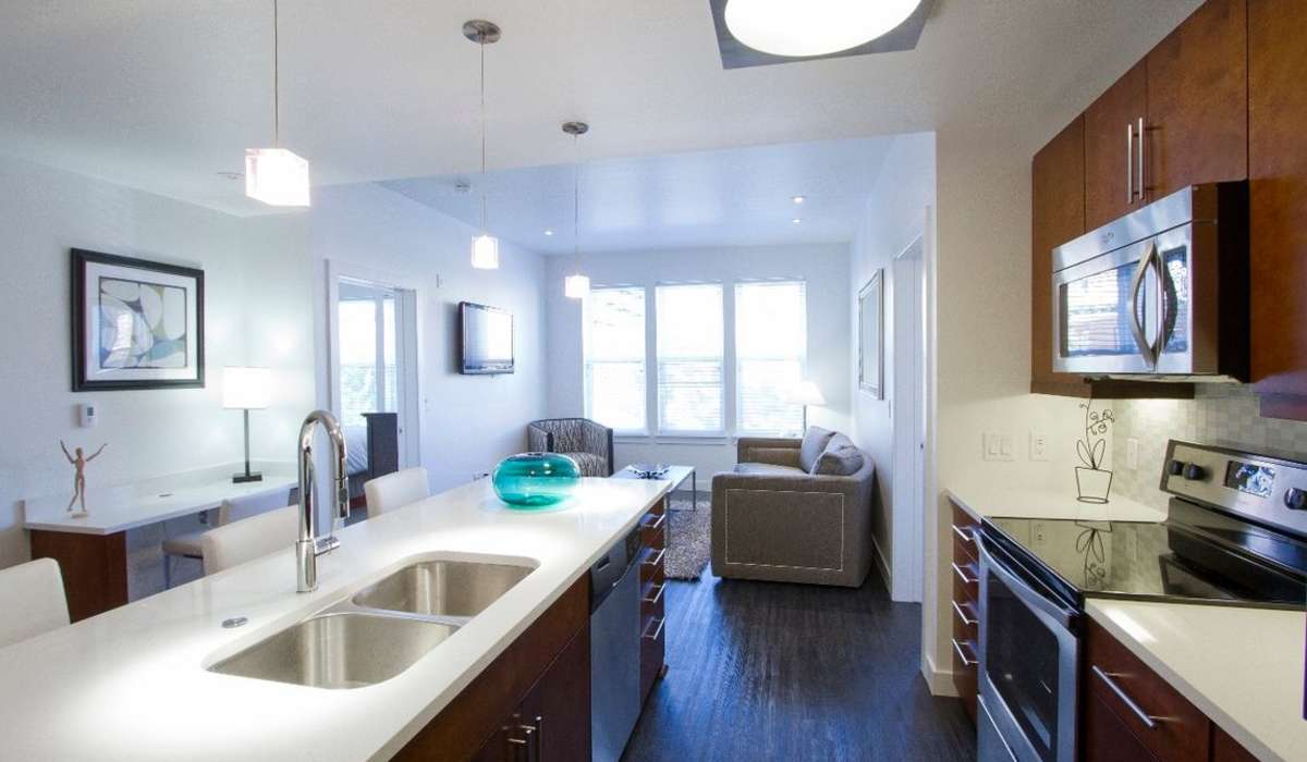 Kitchen with view to the living room at One City Block in Denver, Colorado