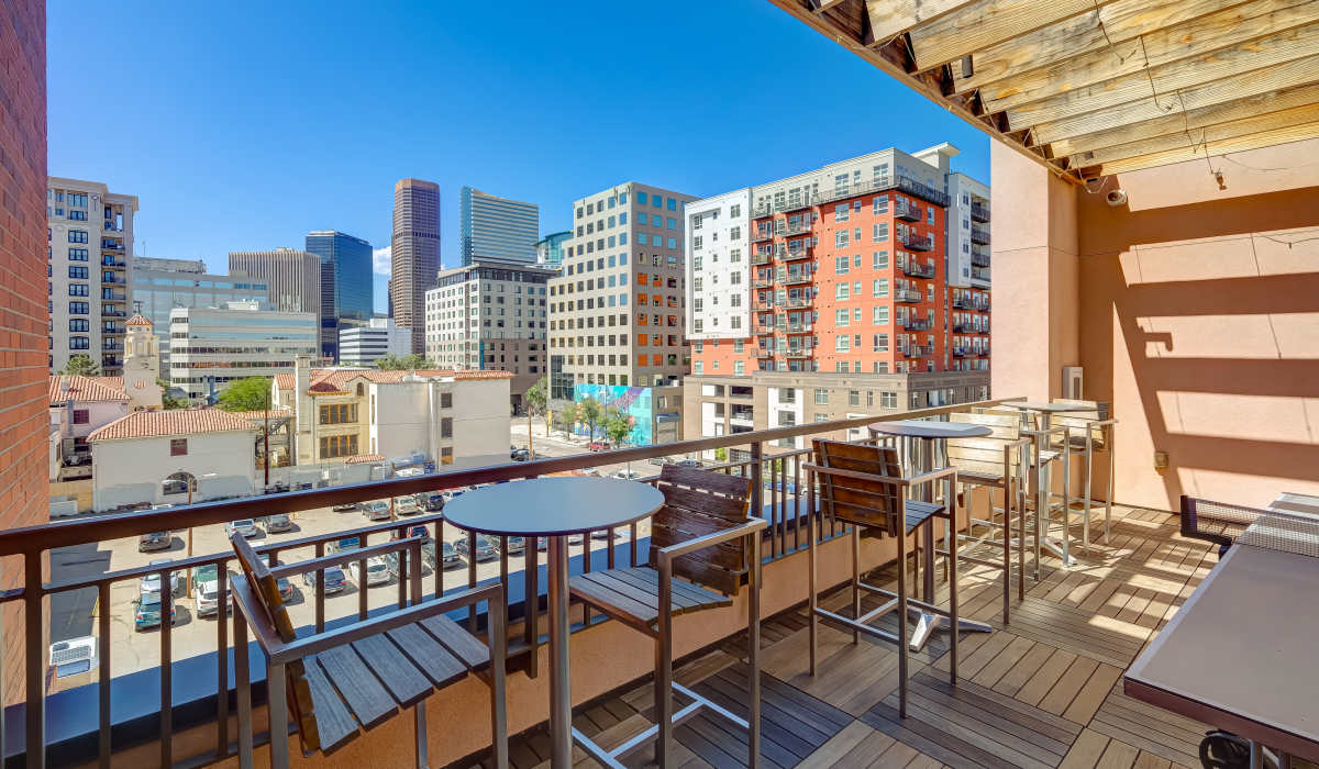 Deck seating with view of the city skyline at One City Block in Denver, Colorado 