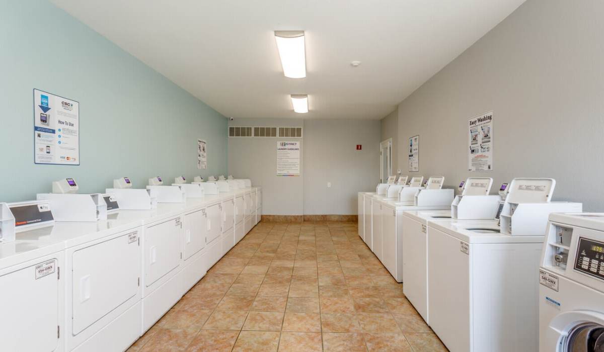 Laundry room at The District At Manhattan Apartments in Manhattan, Kansas