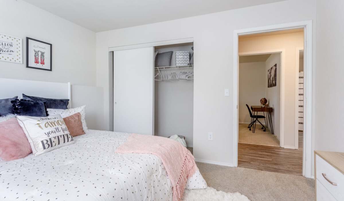 Master bedroom with a closet at The District At Manhattan Apartments in Manhattan, Kansas