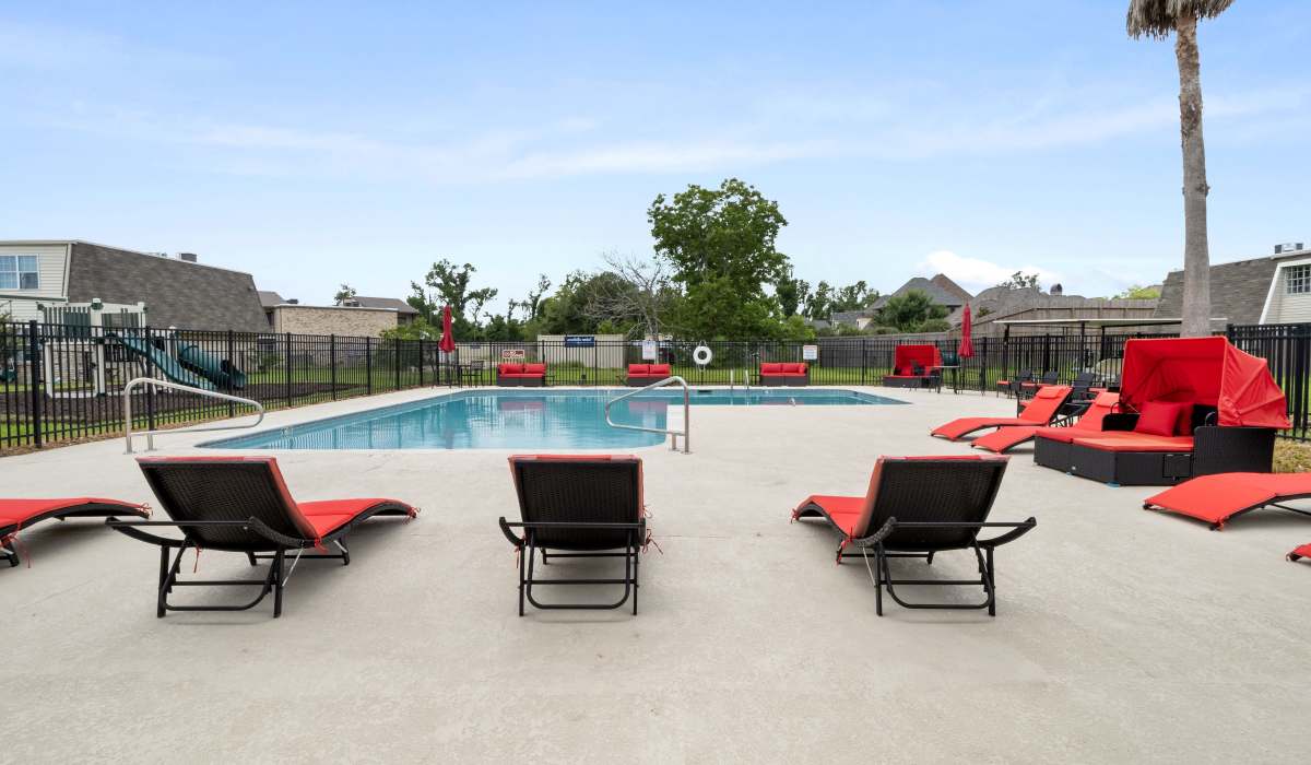 Couple enjoying their pool session in the community pool at Satsuma Village in Lake Charles, Louisiana