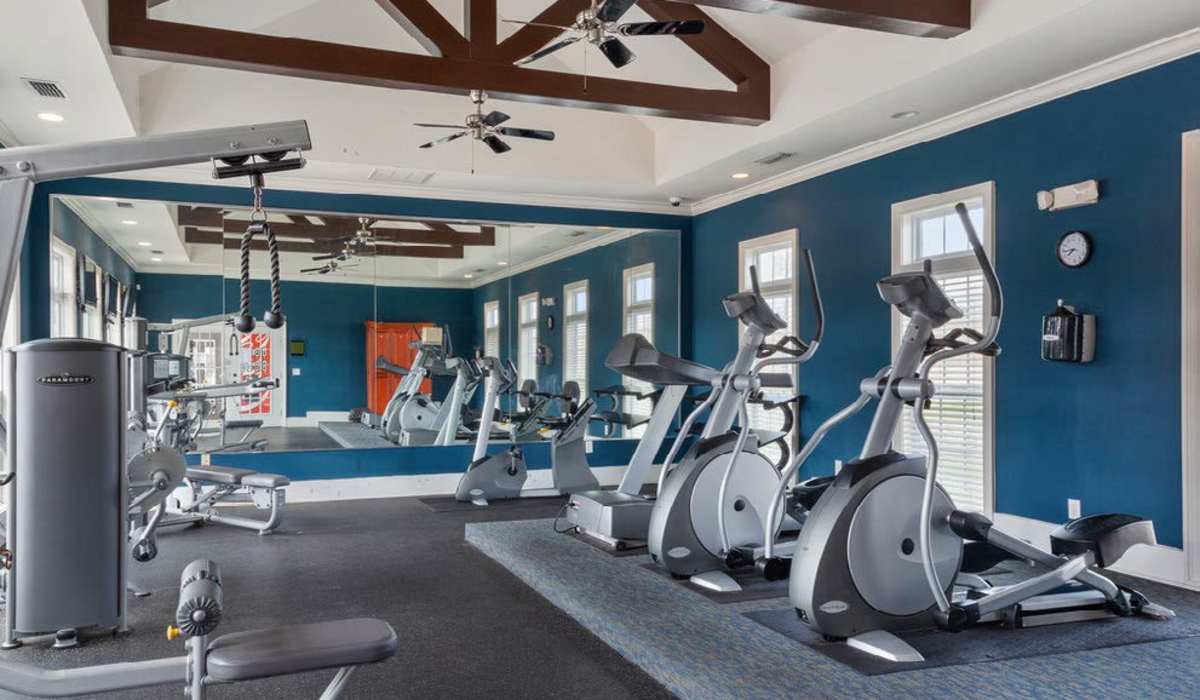  Fitness center with multiple treadmills and a mirror at Ansley Place in Houma, Louisiana