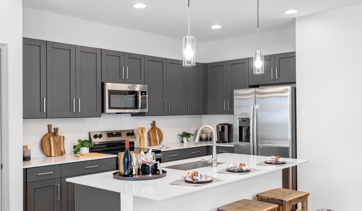 Kitchen with beautiful counter top at Tredici at Central Park in Port St. Lucie, Florida