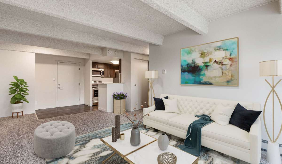 Spacious living room with plush carpet flooring and unique roofing at The Windermere in Littleton,Colorado