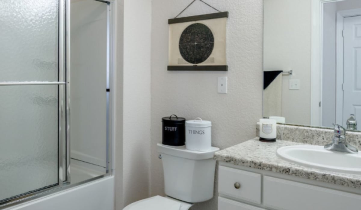 Model bathroom with white walls at The Pointe On College Avenue in Manhattan, Kansas