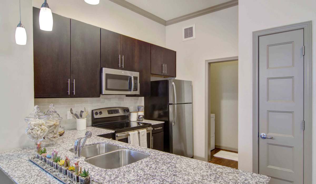 Modern light fixtures in an apartment kitchen at Twenty25 Barrett in Kennesaw, Georgia