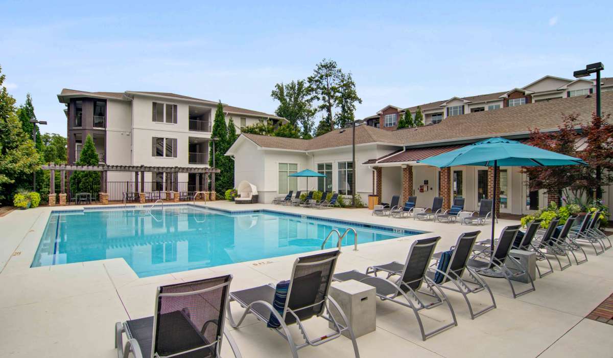 Lounge seating surrounding the community swimming pool at Twenty25 Barrett in Kennesaw, Georgia