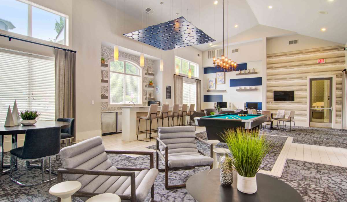 Seating and billiards table in the clubhouse at Twenty25 Barrett in Kennesaw, Georgia