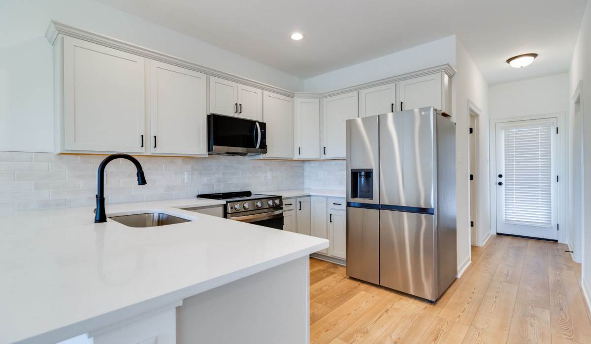 Kitchen in a model home at Cottages at Sugar Mill Pond in Youngsville, Louisiana