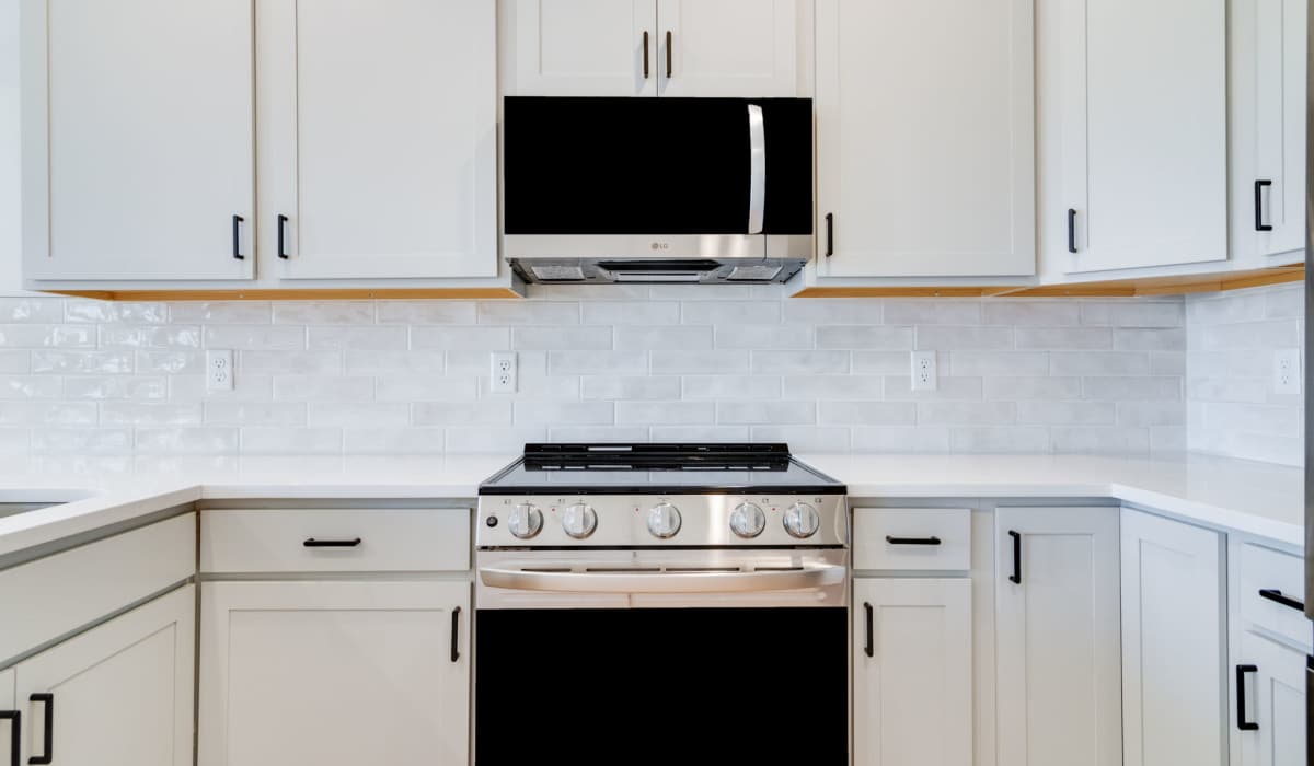 Stainless-steel appliances in the kitchen of a model home at Cottages at Sugar Mill Pond in Youngsville, Louisiana
